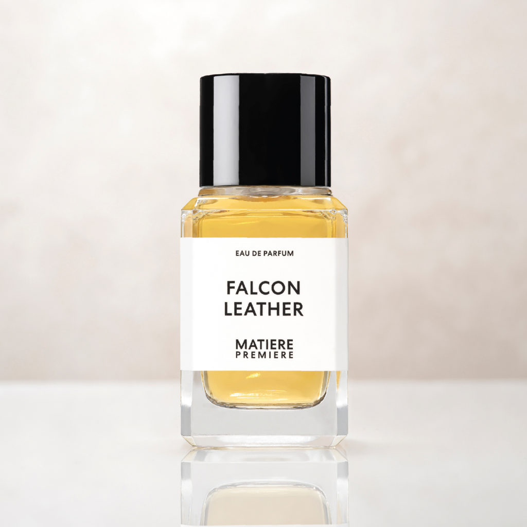 a bottle of perfume with a black cap